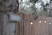 Sign and solar lights in the cottage garden