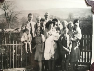 Historical family photo outside the cottage